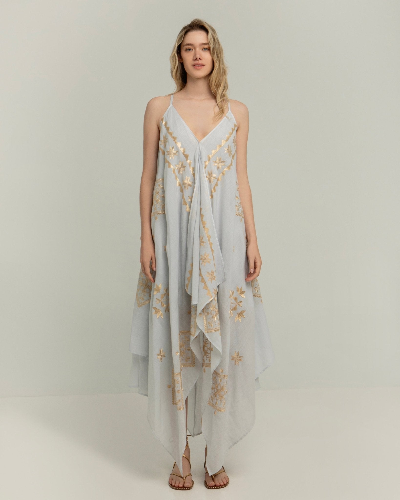 Greek Archaic Kori Asymmetrical Lefkada Dress | Light Grey & Gold. Available at Pasha Living