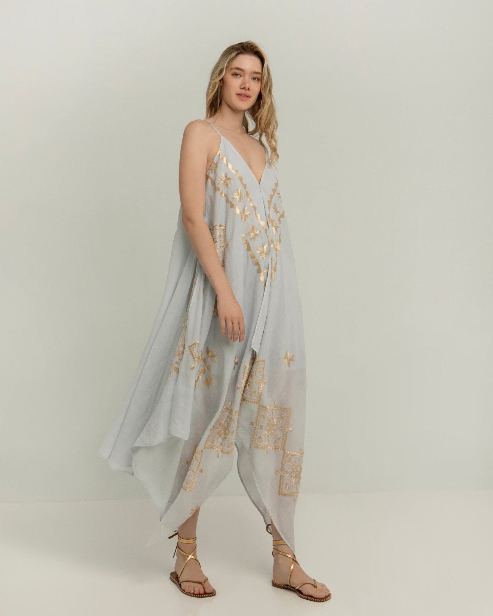 Greek Archaic Kori Asymmetrical Lefkada Dress | Light Grey & Gold. Available at Pasha Living