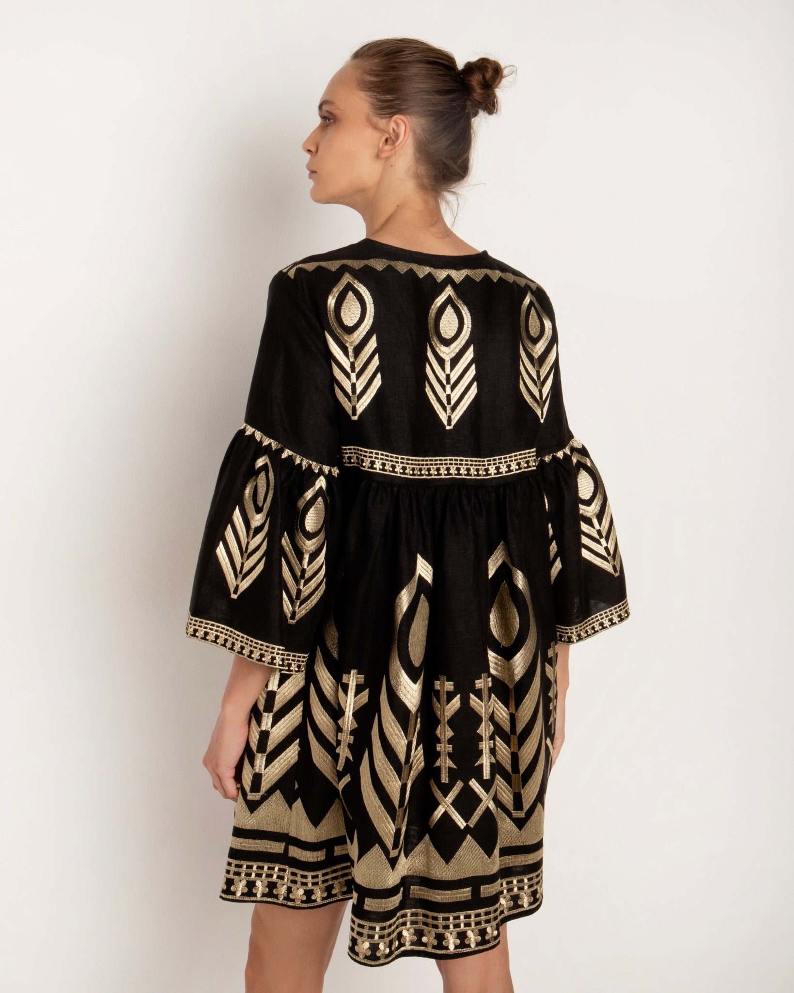 Greek Archaic Kori Black & Gold Feather Embroidered Dress. Available at Pasha Living