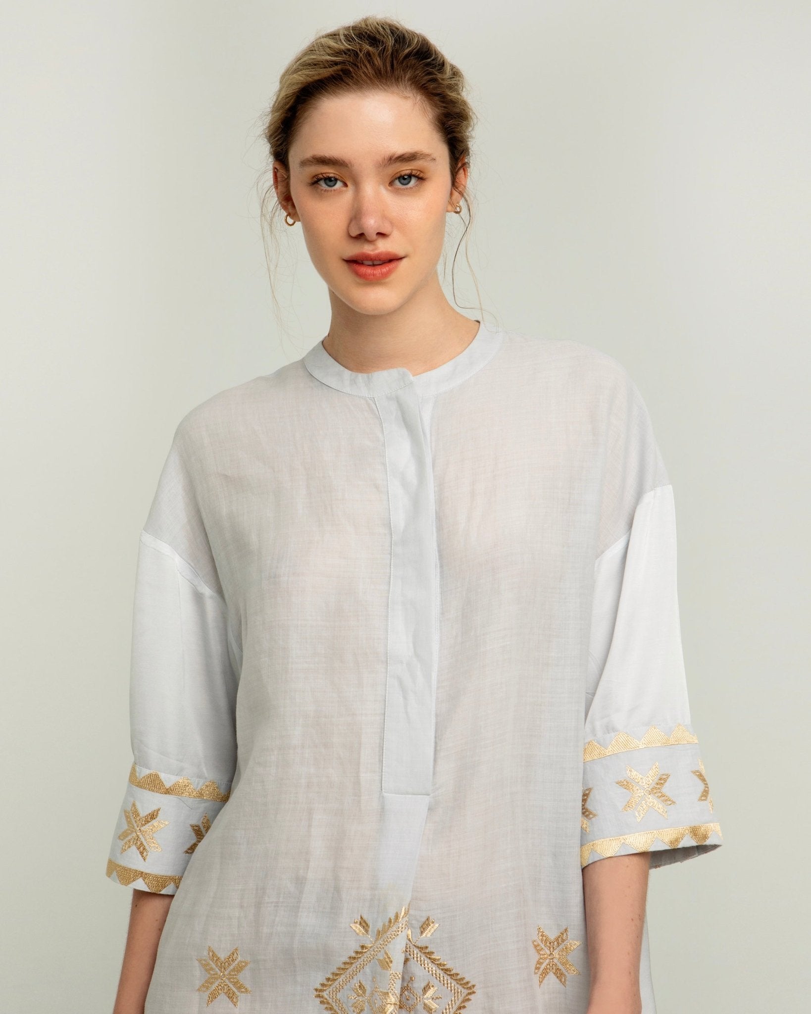 Greek Archaic Kori Lefkada Tunic Dress | Light Grey & Gold. Available at Pasha Living