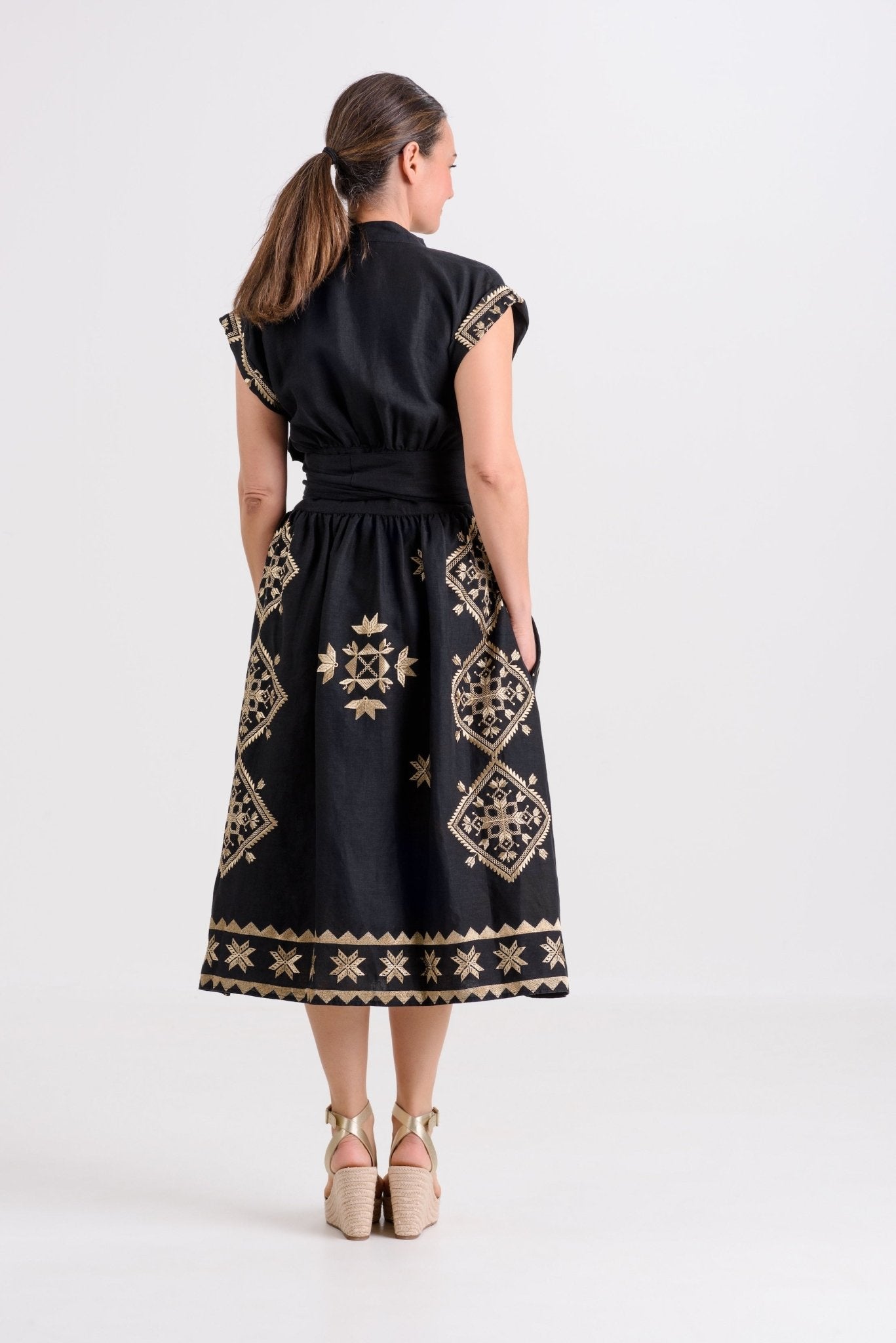Greek Archaic Kori Lefkada Wrap Dress | Black & Gold. Available at Pasha Living