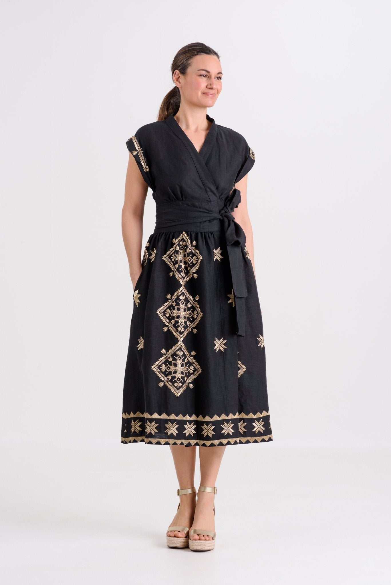 Greek Archaic Kori Lefkada Wrap Dress | Black & Gold. Available at Pasha Living