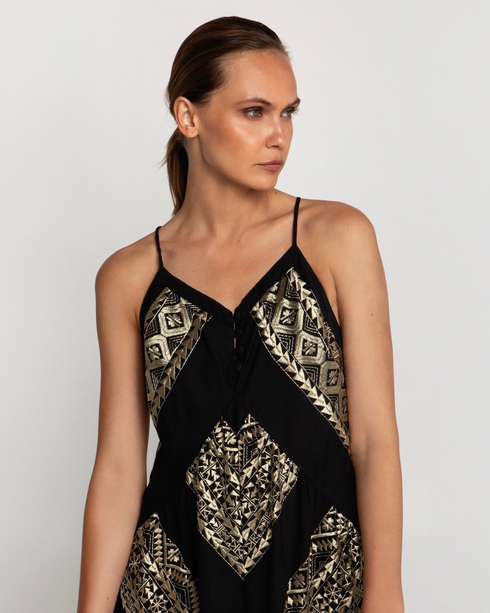 Greek Archaic Kori Long Classic Triangle Dress With Buttons | Black & Gold. Available at Pasha Living