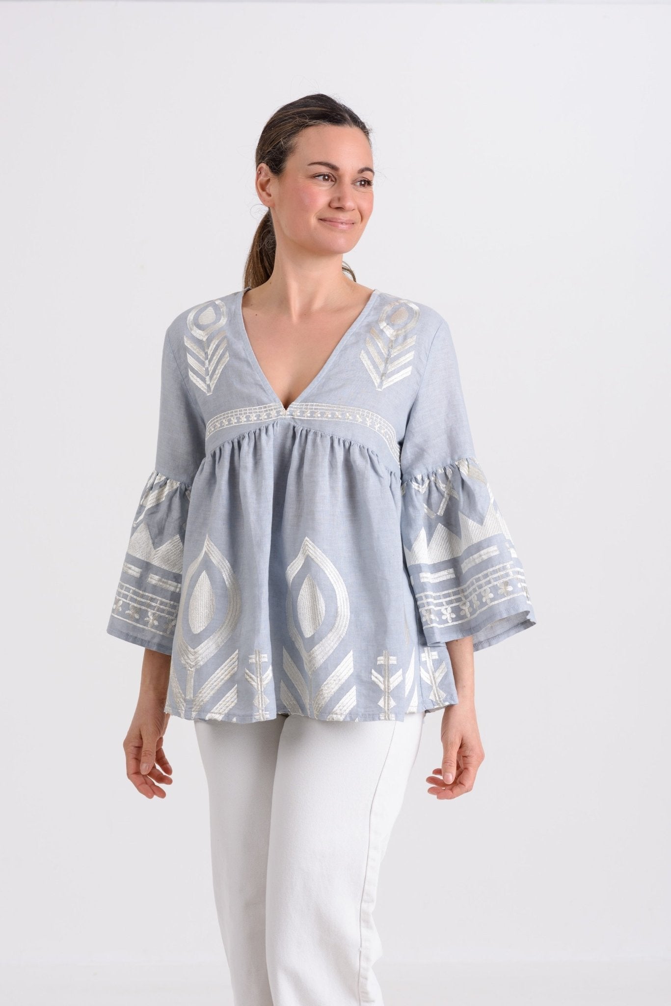 Greek Archaic Kori Short Feather Bell Sleeve Blouse | Grey & Champagne. Available at Pasha Living