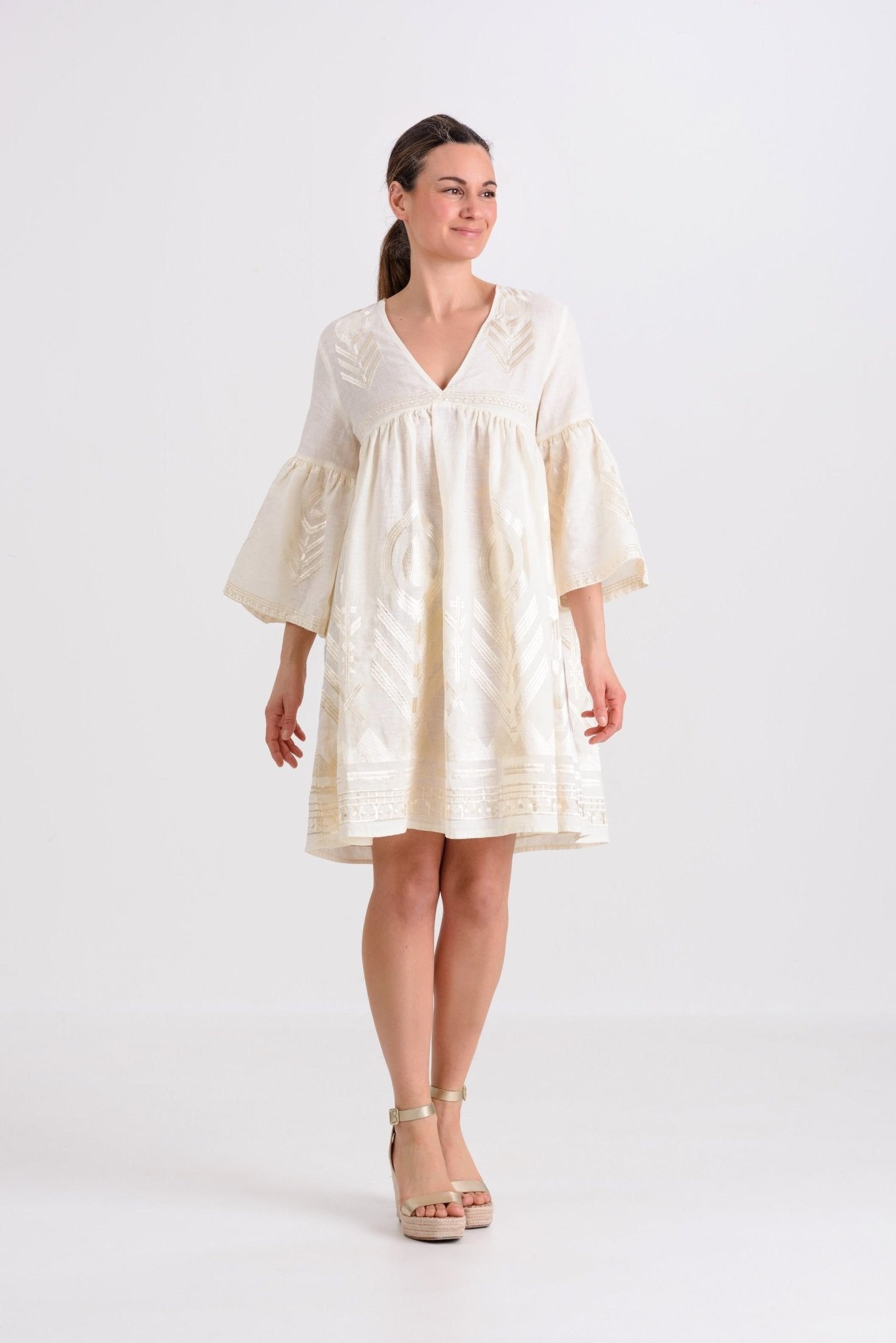 Greek Archaic Kori Short Feather Bell Sleeve Dress | Natural & Champagne. Available at Pasha Living