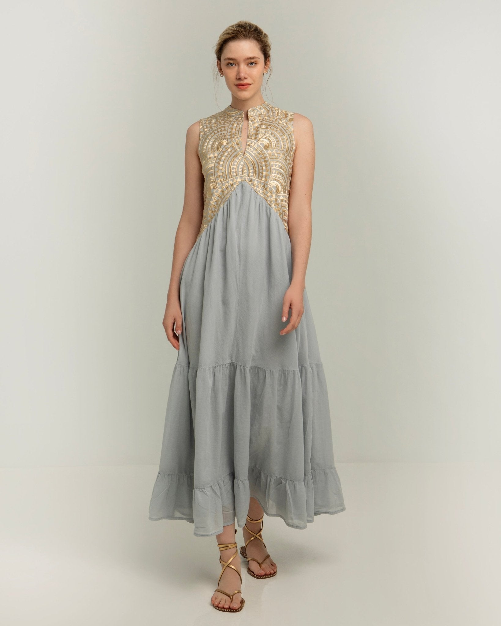 Greek Archaic Kori Sleeveless Voile Maxi Dress | Light Grey & Gold. Available at Pasha Living