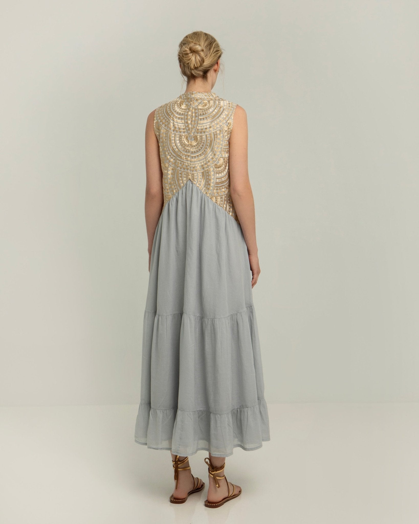 Greek Archaic Kori Sleeveless Voile Maxi Dress | Light Grey & Gold. Available at Pasha Living