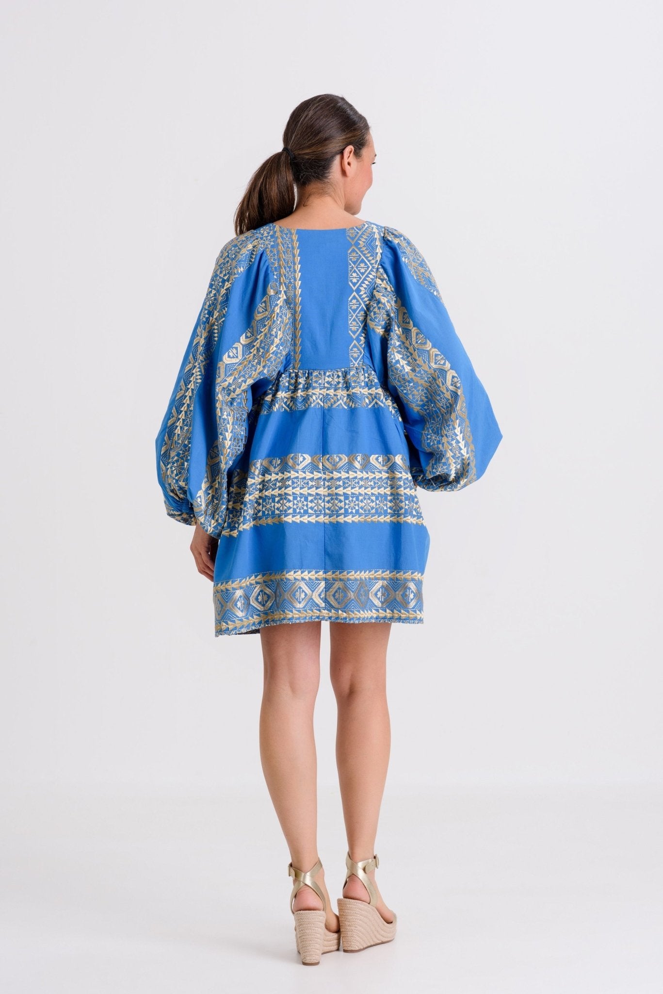 Greek Archaic Kori Triangle Sleeved Mini Dress | Blue & Gold. Available at Pasha Living