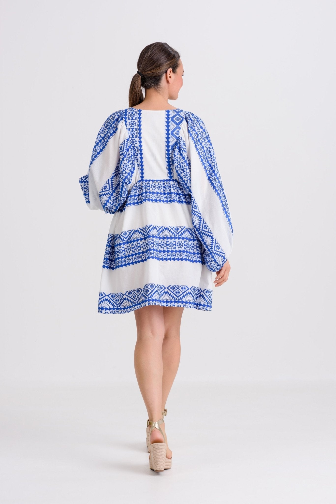Greek Archaic Kori Triangle Sleeved Mini Dress | White & Blue. Available at Pasha Living