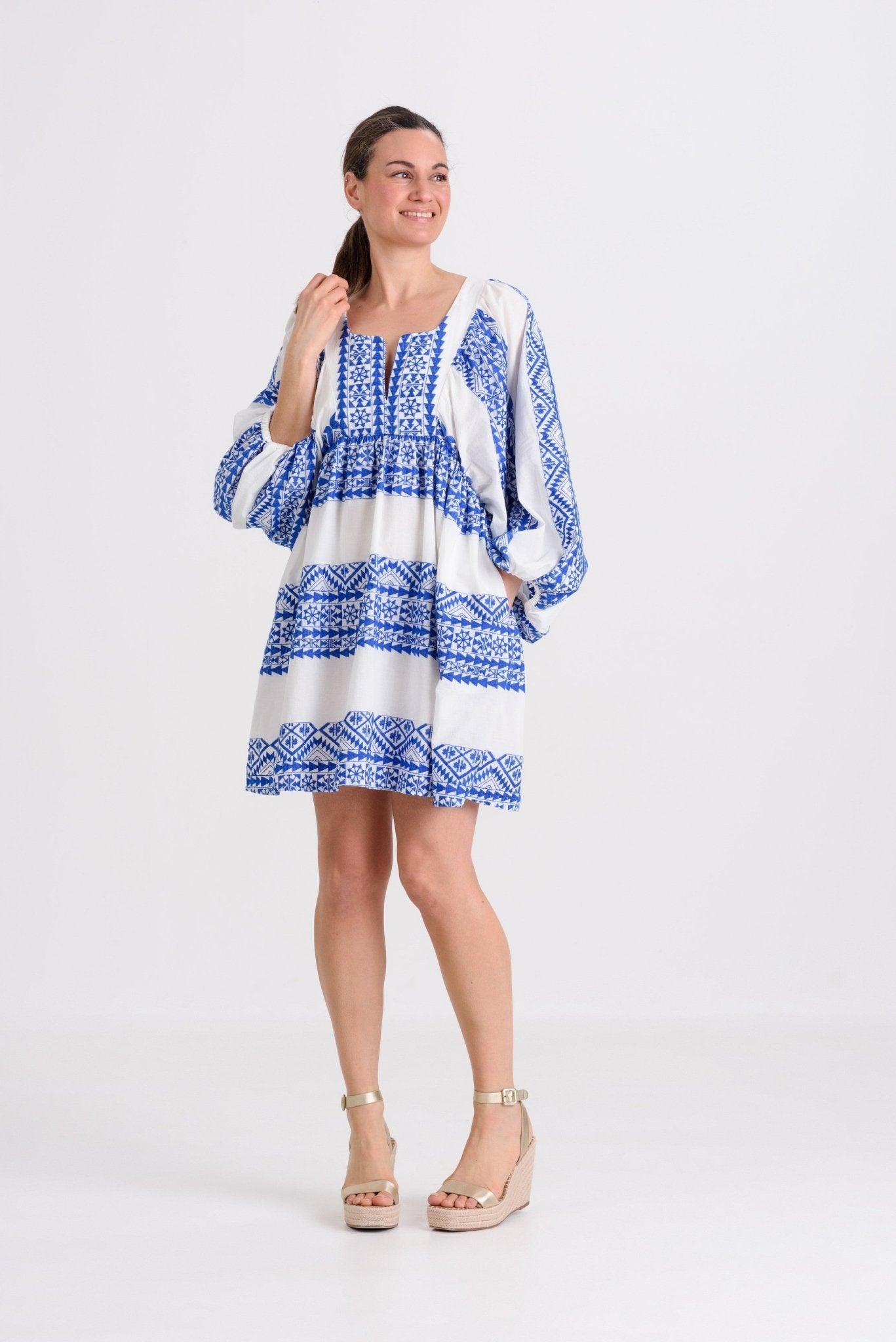Greek Archaic Kori Triangle Sleeved Mini Dress | White & Blue. Available at Pasha Living