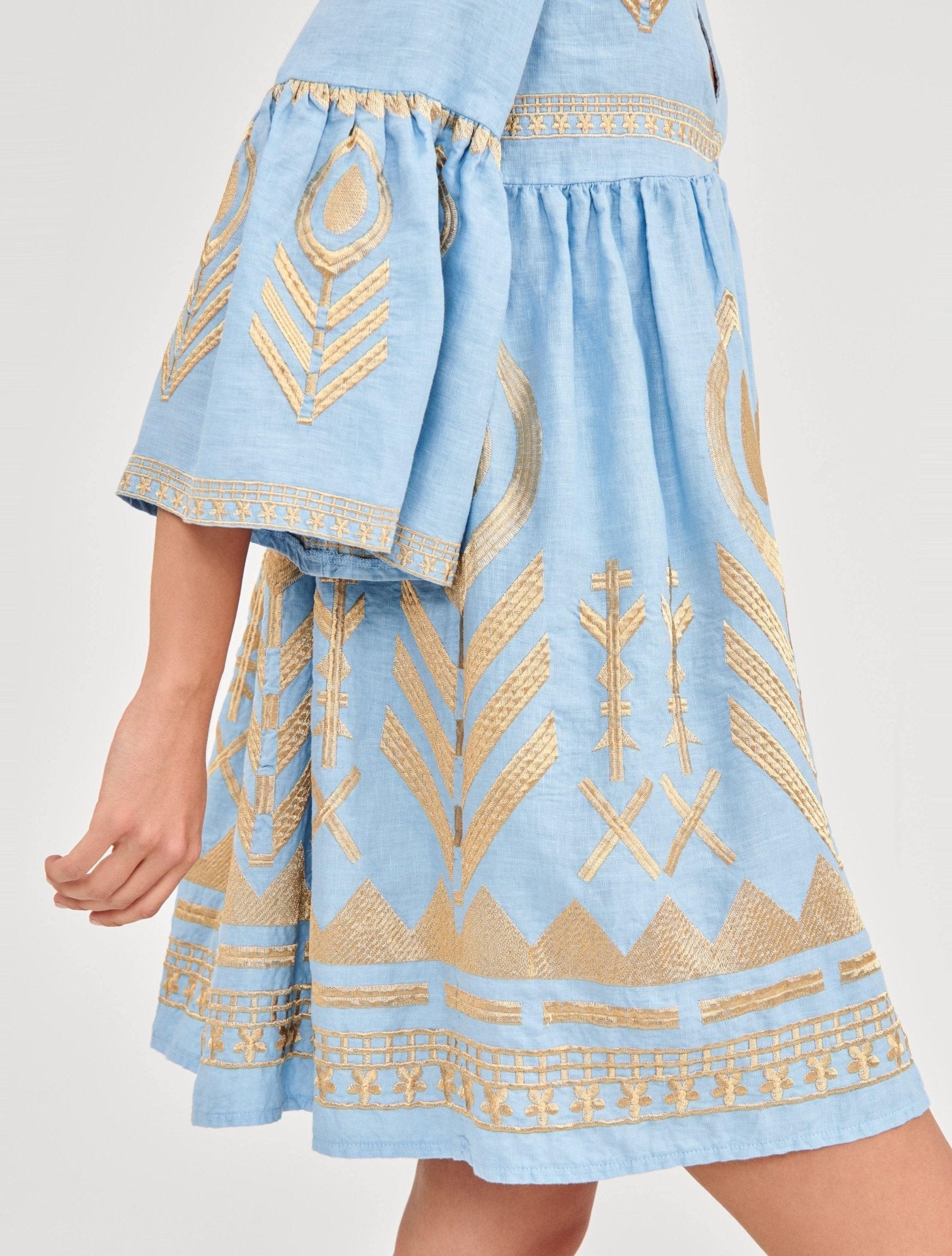 Greek Archaic Kori Light Blue & Gold Feather Embroidered Dress. Available at Pasha Living