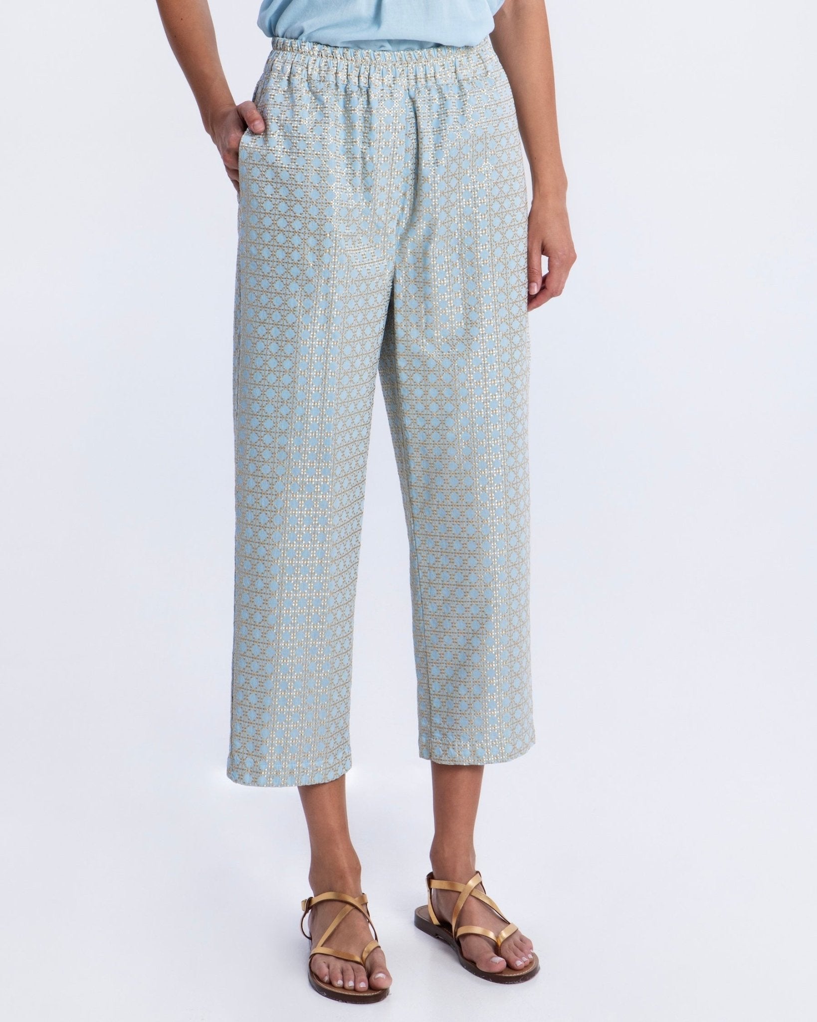 Greek Archaic Kori Cross Trousers | Ciel & Gold. Available at Pasha Living