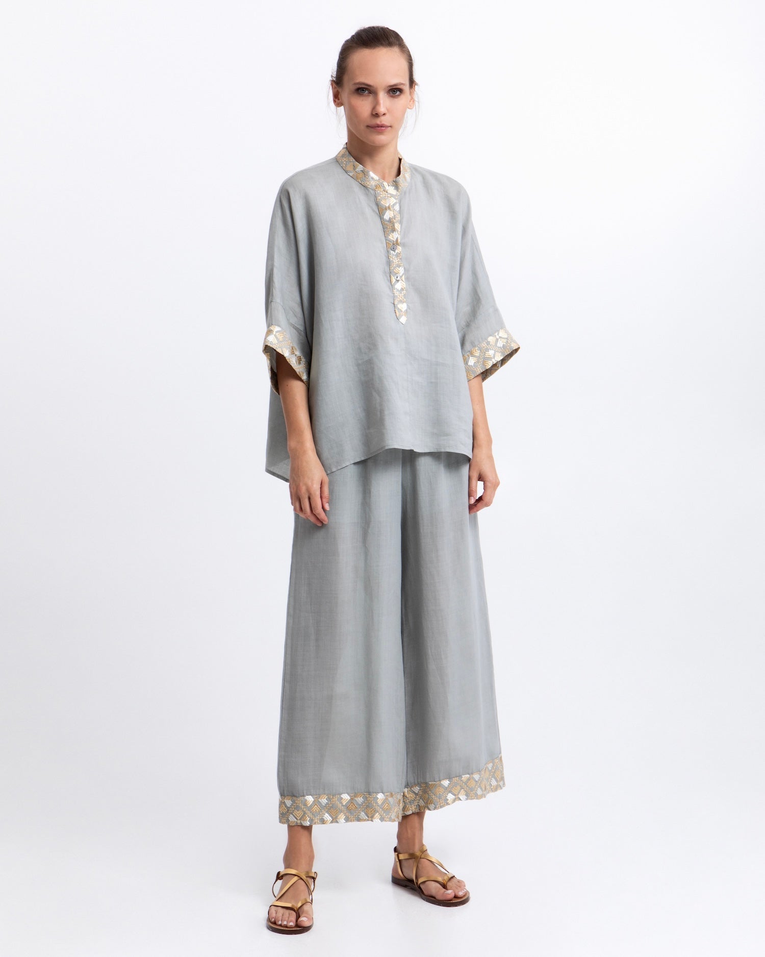 Greek Archaic Kori Flakes Ramie Trousers | Stone & Gold. Available at Pasha Living