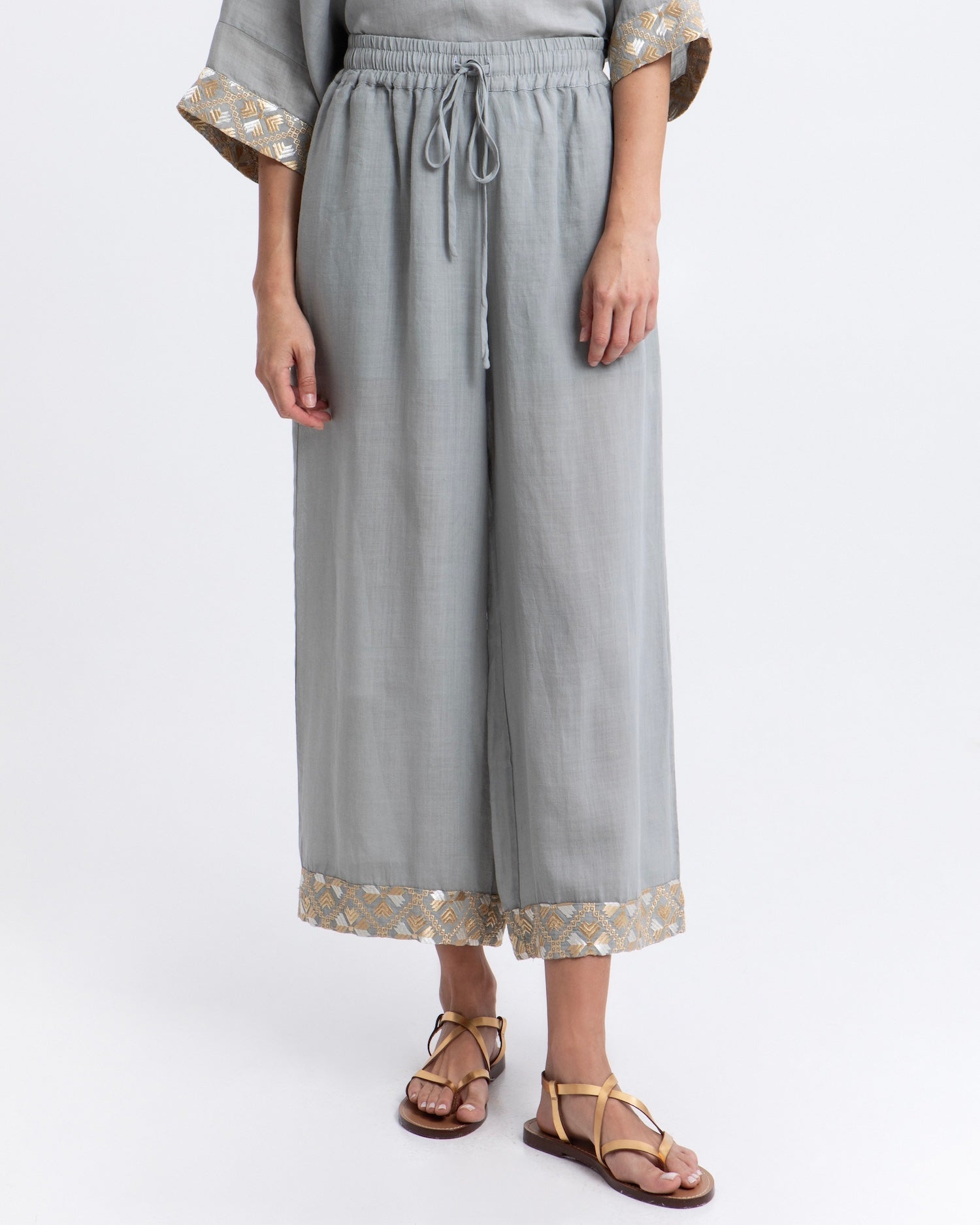 Greek Archaic Kori Flakes Ramie Trousers | Stone & Gold. Available at Pasha Living