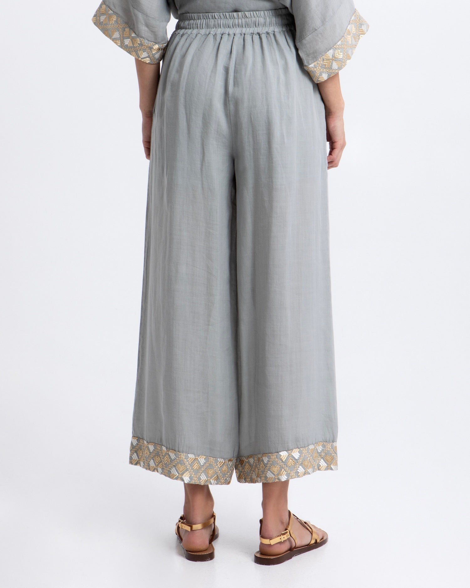 Greek Archaic Kori Flakes Ramie Trousers | Stone & Gold. Available at Pasha Living