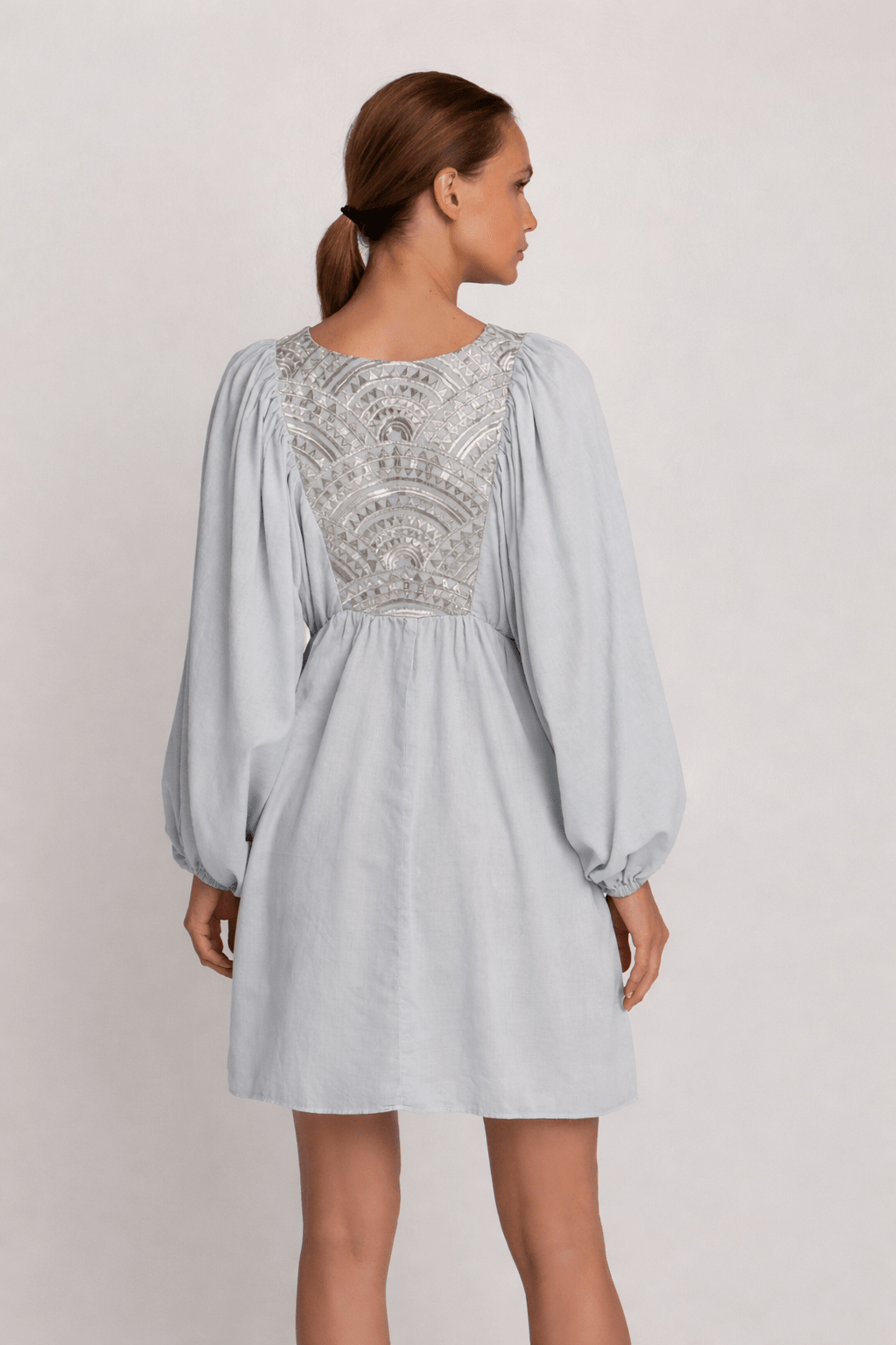 Greek Archaic Kori Mini Dress With Blouson Sleeves | Light Grey & Champagne. Available at Pasha Living