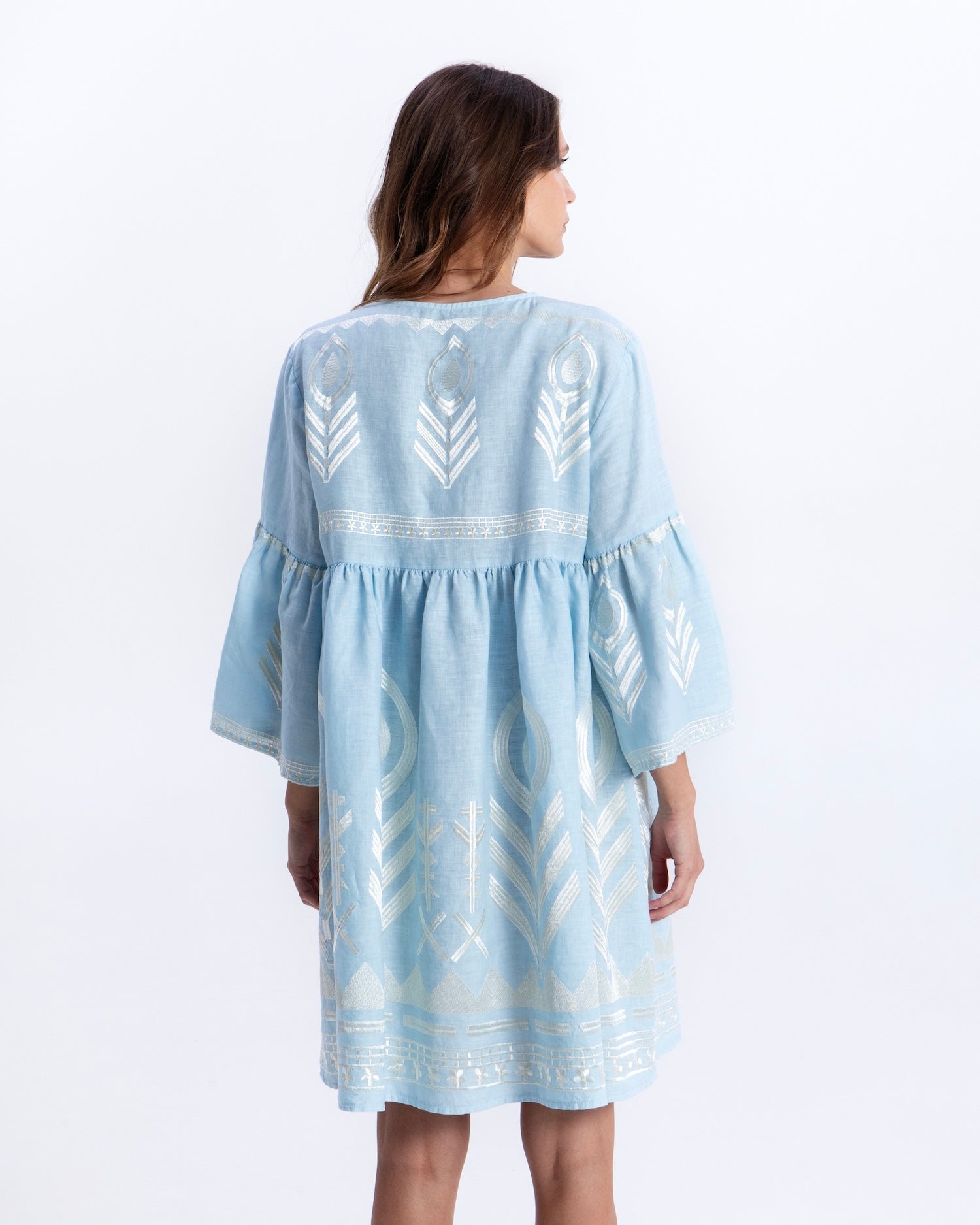Greek Archaic Kori Short Feather Bell Sleeve Dress | Ciel & Champagne. Available at Pasha Living