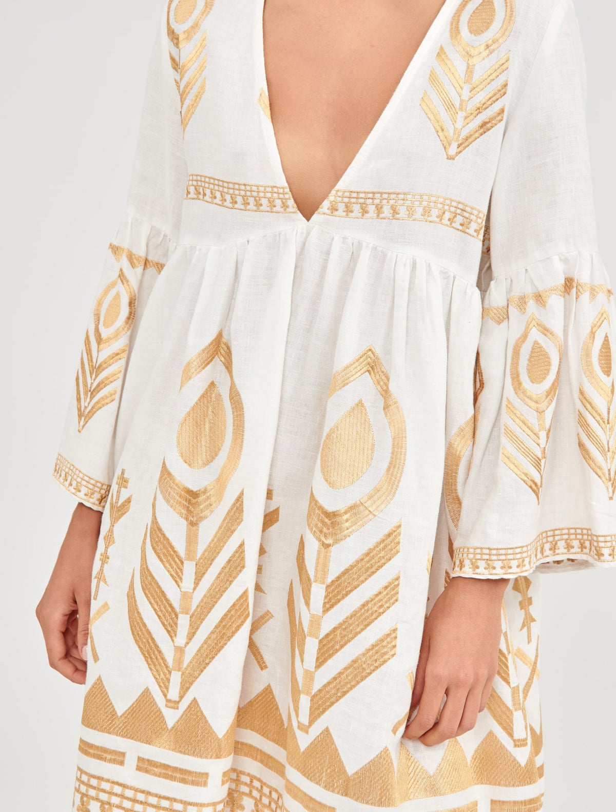 Greek Archaic Kori Kori Short White & Gold Feather Embroidered Dress. Available at Pasha Living