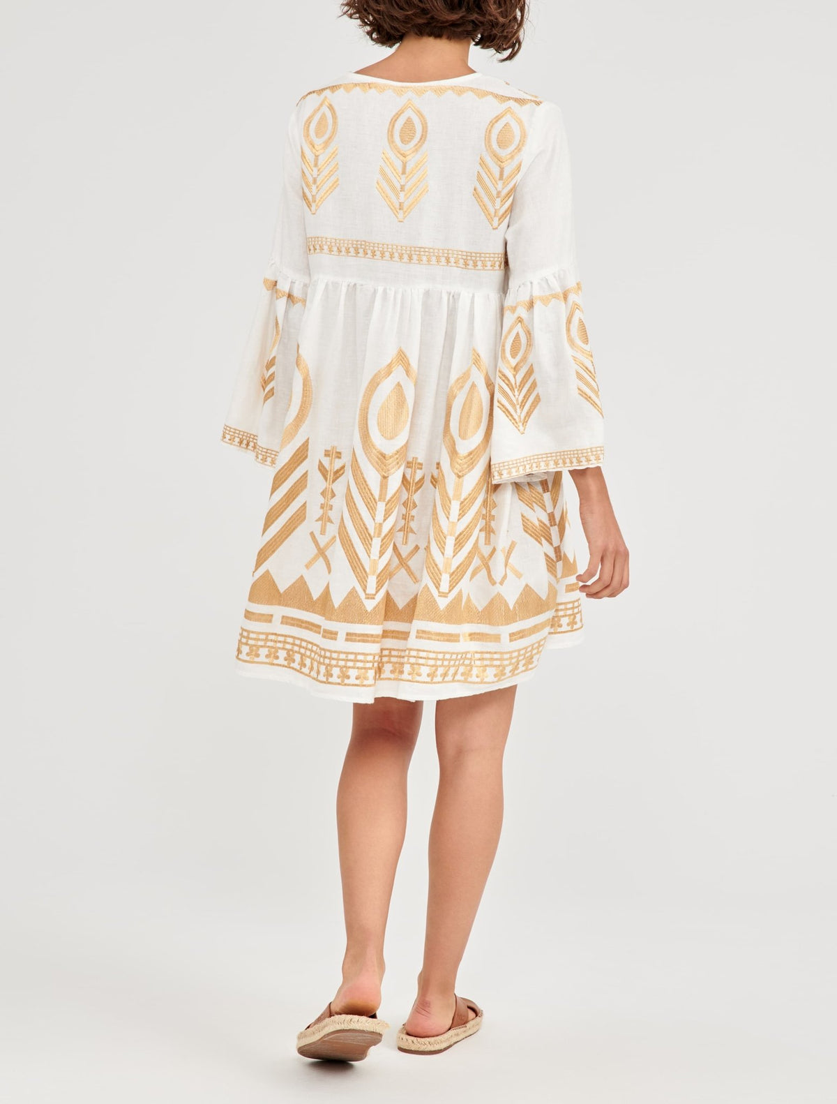 Greek Archaic Kori Short White & Gold Feather Embroidered Dress. Available at Pasha Living
