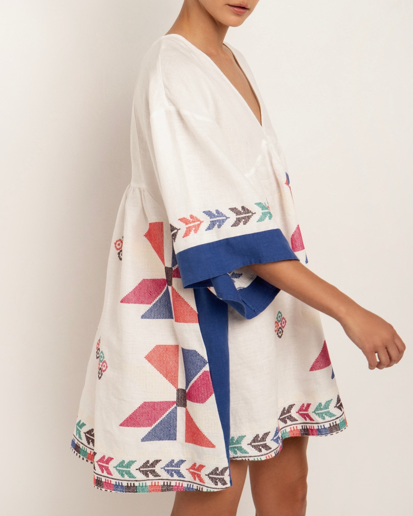 Greek Archaic Kori White Embroidered Tunic Dress, multi blue. Available at Pasha Living