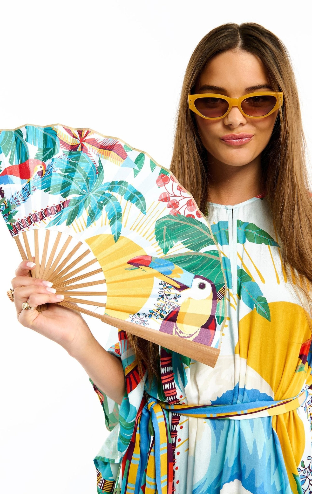 Wild Tropical Print Hand Fan | Blue. Available at Pasha Living